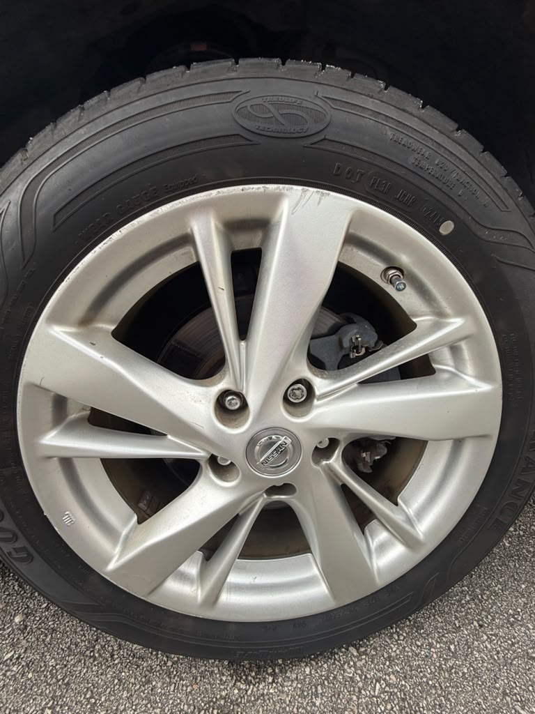 Wheel and tire reviewed as part of the Nissan Altima inspection